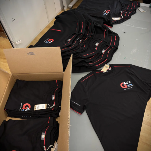 Pantalons de travail noirs personnalisés avec le logo G Auto sur la poche